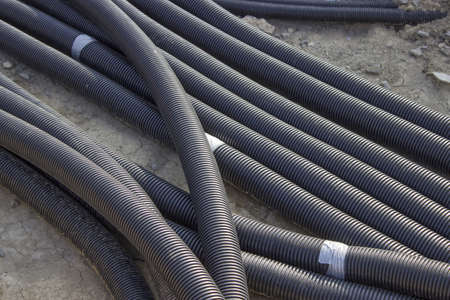 Flexible industrial plastic pipes on construction siteの写真素材