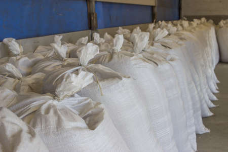 sacks stacked in the truck, ready for transportation. Focus on the front sacks.の写真素材