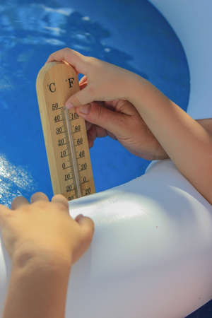 Swimming Pool Water Temperatures, thermometer in a children's pool