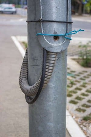 Two wires were installed on to the lugs that the electric utility uses for the street sighting pole supply. Electrical connection directly to the main electricity supply cable bypassing the meter.の写真素材