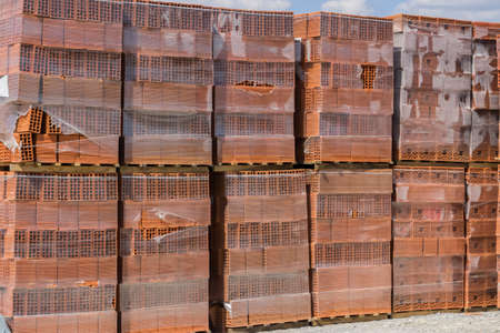 Stack of hollow clay block for building, clay block background