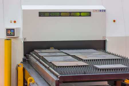 Steel plates cutting on laser cutting machine. Cutting metal plates, stainless steel plate laser processing. Selective focus and shallow 
dof.の写真素材