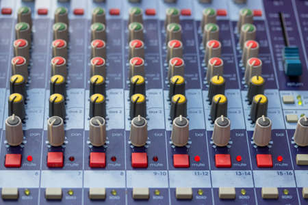 Buttons on sound mixer control panel. Selective focus and shallow dof.の写真素材