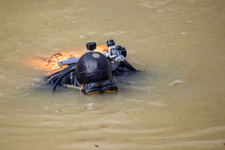 scuba diver clean garbage from river, collecting trash from the bottom of the riverの写真素材