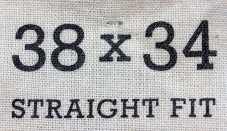 Size label for jeans pants. Label for clothing, size 38 x 34 straight fitの写真素材