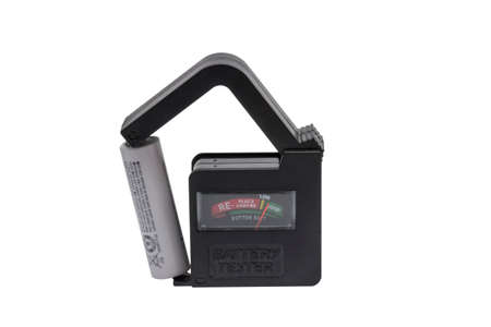 Universal Battery Tester AA AAA C D 9V Button Checker with aa battery, isolated on white backgroundの写真素材