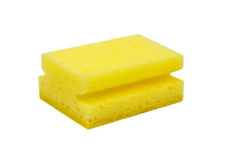 Yellow scrubbing sponge, washing sponge isolated on white の写真素材