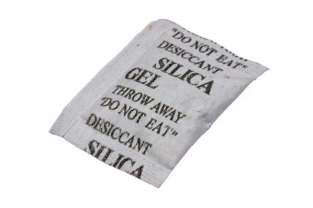 Silica gel in a porous packet isolated on white with clipping pathの写真素材