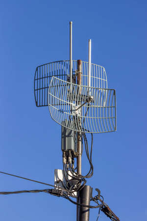 Outdoor wireless parabolic directional antennas on pole, grid antennas