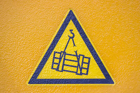 Safety sticker on telescopic crane. Overhead crane crush hazard sign.の写真素材