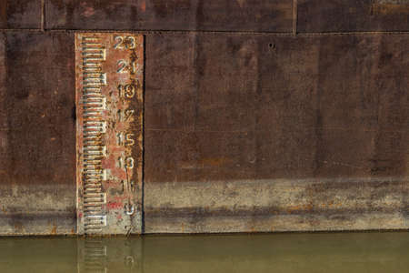 Plimsol Line or load line, which is a visible line designed to protect sailors from ships being loaded with too much cargo. The mark is printed onto the sides of cargo ships.の写真素材