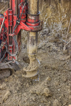 Drill bit with motion blur on ground hole drilling machine.の写真素材