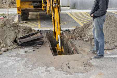 Excavating collapsed sewer line, sewer line replacement. Sewer line partial replacement.の写真素材