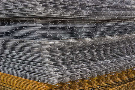 Reinforcement steel mesh background at the construction site. Mesh and bar.の写真素材