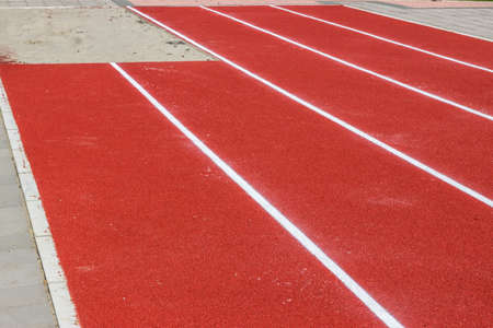 New track and long jump pit in a schoolyardの写真素材