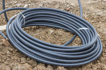 rolled pvc pipe for water supply at the construction siteの写真素材