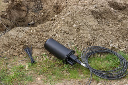 Drilling under street for fibre optic cable installation with splice enclosure. Selective focus.の写真素材