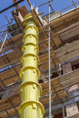 Garbage tube to dump debris at construction site. Debris tube for transporting debris from upstairs.の写真素材