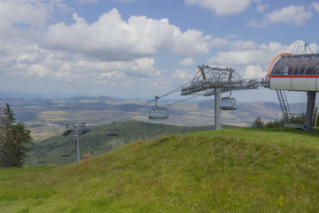 Ski lift on on the top of mountain in summerの写真素材