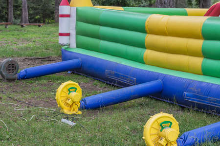 Inflatable fan blowers on bouncy castle, air blowers. Selective focus.の写真素材