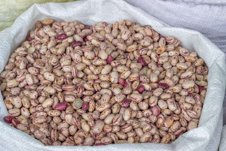 Farmers market colorful beans in sack. At the farmers market local growers come and sell their freshly picked crops at reasonable prices. Selective focus.の写真素材