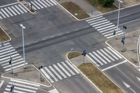 Urban street intersection seen from a building high aboveの写真素材