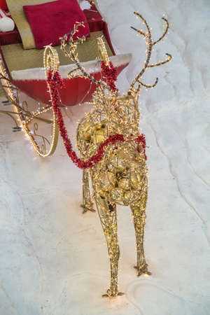 Christmas decoration santa reindeer and sleigh. Christmas decoration in shopping mall. Selective focus.の写真素材
