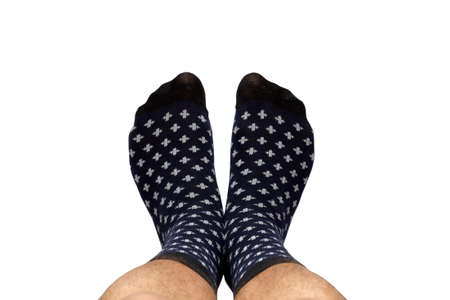 Feet in socks from above with space for your text, isolated on white background and made with selective focus.の写真素材