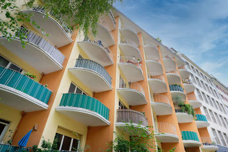 many semicircular balconies on a colorful residential building from the middle of the 20th century...