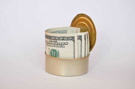 Tin can full of dollar billsの写真素材