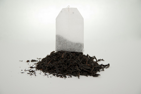 teabag is on the pyramid of tea leavesの写真素材