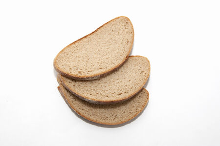 three pieces of bread isolated on white の写真素材