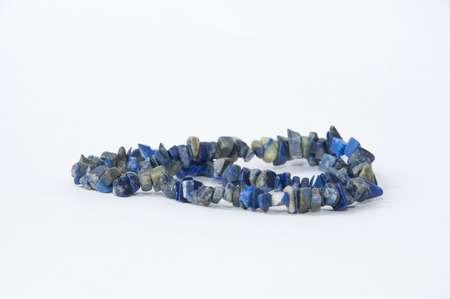 the necklace made of natural stone color blue on a white background