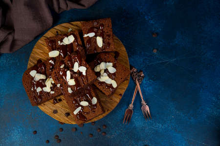 Homemade brownie chocolate cakes on a wooden boardの写真素材
