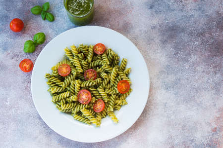 traditional Italian dish. vegetarian pasta with green Basil pesto, Parmesan and pine nuts.の写真素材
