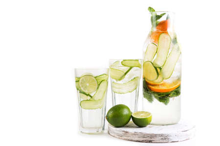 Homemade healthy lemonade with lemon, cucumber and mint isolated on white background