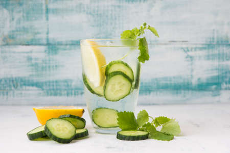 Natural detox water with cucumber, lemon and mint. Natural homemade lemonade.