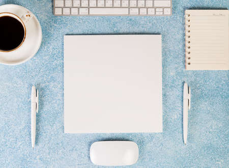 Layout of items for work in the office. Office Desk, computer keyboard, computer mouse, coffee Cup,...
