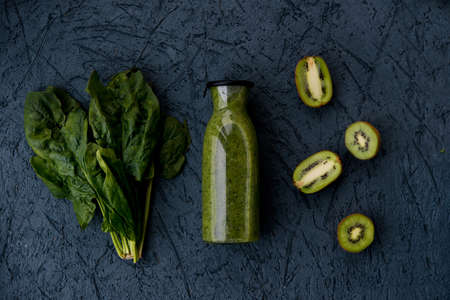 Vegetarian green spinach and kiwi smoothieの写真素材