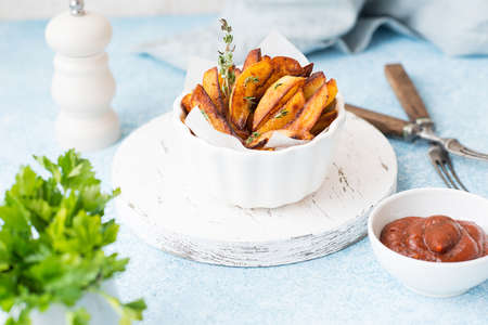 Homemade baked fried potatoes with herbs 