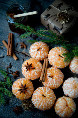 New year's composition with tangerines, spices and Christmas tree branches, a symbol of the New Yearの写真素材