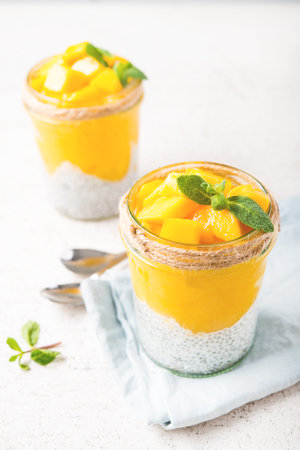 Vegetarian chia pudding with mango in a jar, selective focusの写真素材