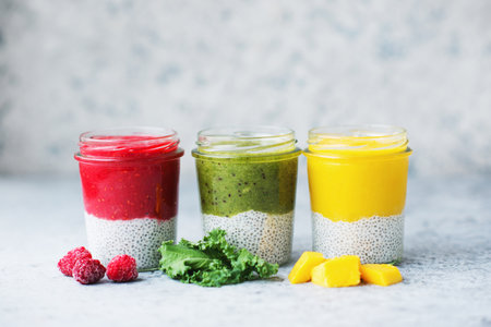 A variety of healthy vegetarian pudding with chia seeds and a variety of fruits and vegetables, clean food, selective focusの写真素材