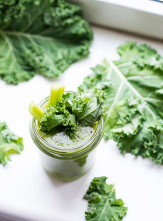 Green detox cocktail with cale salad, vegetarian healthy smoothie in a jar, selective focusの写真素材
