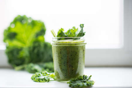 Green detox cocktail with cale salad, vegetarian healthy smoothie in a jar, selective focus, copy spaceの写真素材