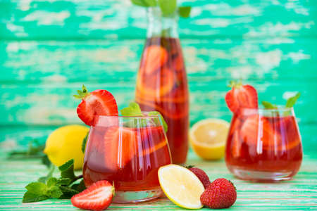 Homemade strawberry lemonade on a rustic background, a refreshing summer drink, selective focusの写真素材