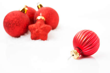 Christmas tree toys, red Christmas balls on a white background, close-up, selective focusの写真素材