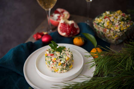 New Year's holiday salad with mayonnaise, New Year's table, champagne, copy spaceの写真素材