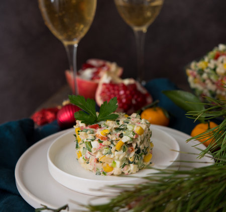 New Year's holiday salad with mayonnaise, New Year's table, champagne, close upの写真素材