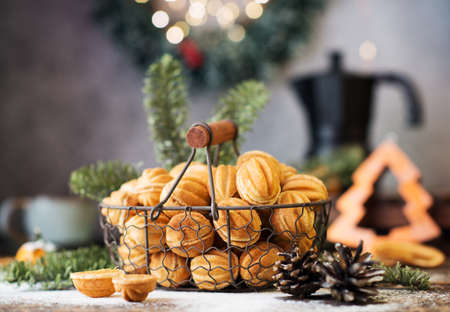 Christmas sweets cookies nuts with condensed milk on the festive table, Christmas decorations, selective focus, close upの写真素材